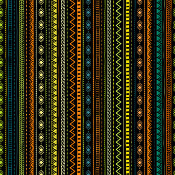 Striped geometric seamless pattern. Colored lines on a dark background. Ethnic and tribal motifs. The vertical direction of the lines. Vector illustration.