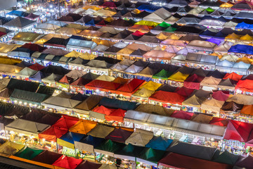 Food Stalls and vendors lit up at the Ratchada Night Market in Bangkok