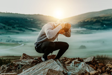 Man rest on top of mount after morning training