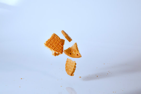biscuits falling on a bright blue background