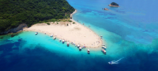 Aerial drone ultra wide photo of iconic small island of Marathonisi with turquoise sea, Zakynthos island, Ionian, Greece