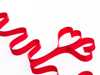 Red heart ribbons on the white background