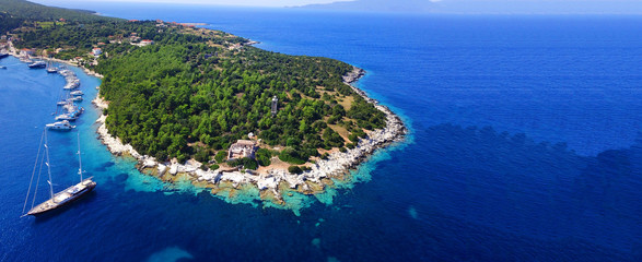 Fototapeta premium Aerial drone ultra wide photo of sail boats docked in paradise bay of Fiskardo, Kefalonia island, Ionian, Greece