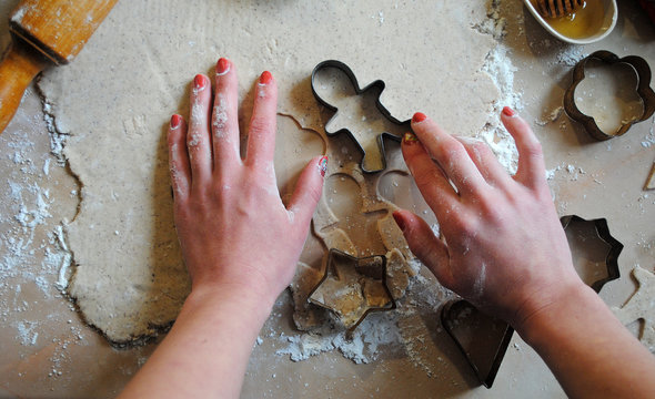 The process of making ginger cookies. Girl is preparing cookies. Gluten free from rice flour. Housewife makes christmas cookies. Close up close shot