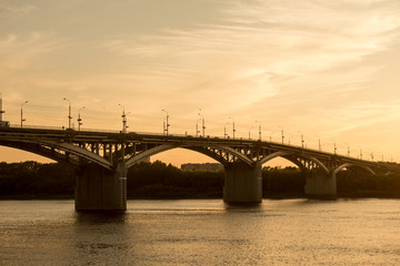 Plakat Sunset over beautiful bridge over river Oka in Nizhniy Novgorod city, Russia
