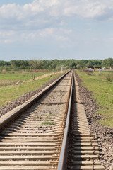Fototapeta na wymiar Railway track goes into the distance and up.