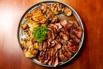 Fresh, juicy assorted sliced grilled meat.