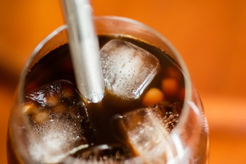 pearl milk tea on glass with stainless steel straw