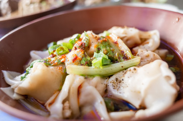 meat dumpling in chili oil