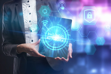 Business, Technology, Internet and network concept. Young businessman working on a virtual screen of the future and sees the inscription: Business network