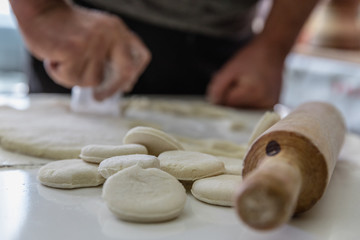 Rolling dough to make traditional Georgian Khinkhali