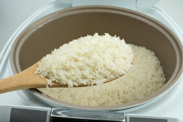 Close up Jasmine rice cooking in electric rice cooker