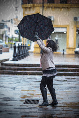 pretty brunette woman in a rainy day