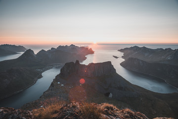 Sun flare during midnight sunset in Senja, Norway