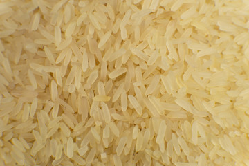 Long grain white rice background. Macro, closeup. Rice texture. Top view.