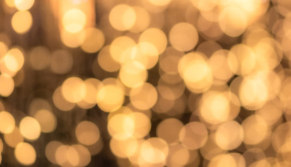 Abstract bokeh light background, warm tone, yellow orange color
