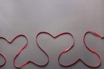 Valentine's Day heart shaped red ribbon. Background