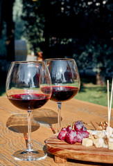 Glasses Of Fine Red Wine With Grape and Cheese