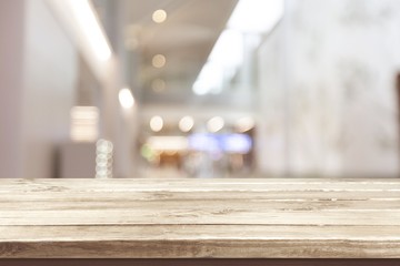 Brown desk with blur interior background