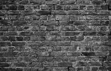 horizontal part of black painted brick wall. Grey Stone wall, bricks pattern, bricks background