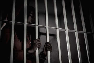 Hands of women desperate to catch the iron prison,prisoner concept,thailand people,Hope to be...