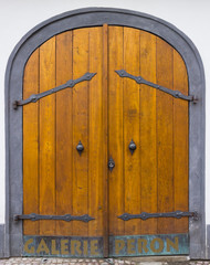 Wooden door with forged elements in high resolution