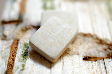 Wooden clean (empty) rune close-up on a wooden background. Soft focus