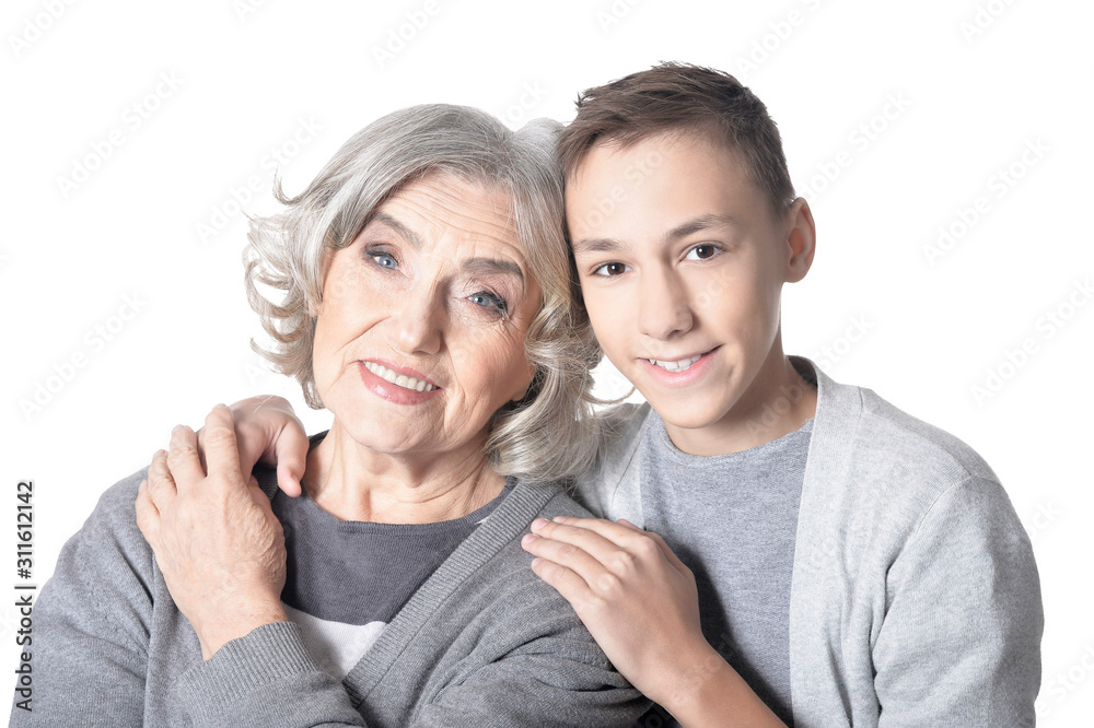 Wall mural Smiling grandmother and grandson isolated on white background