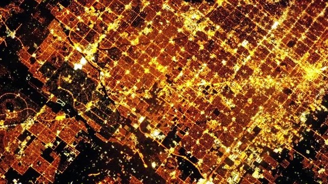 Night lights pattern city aerial satellite view of Phoenix, Arizona, aerial zoom out. Contains public domain image by Nasa