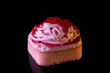 Freshly baked strawberry soft cake with cream and dried berry sprinkle on top