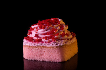 Freshly baked strawberry soft cake with cream and dried berry sprinkle on top