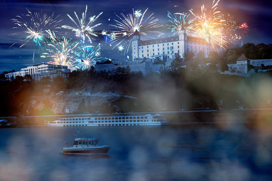 celebrate abstract holidays in bratislava, slovakia, europe. christmas or new year fireworks at night. composite imagery