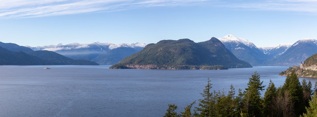 Tunnel Bluffs Hike, in Howe Sound, North of Vancouver, British Columbia, Canada. Panoramic Canadian Mountain Landscape View from the Peak during sunny winter evening.