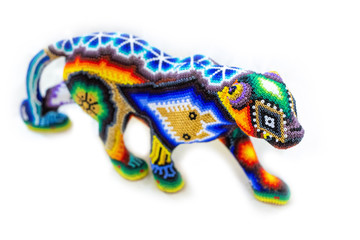 Traditional huichol bead ornament figures mexican culture © PhotoSpirit