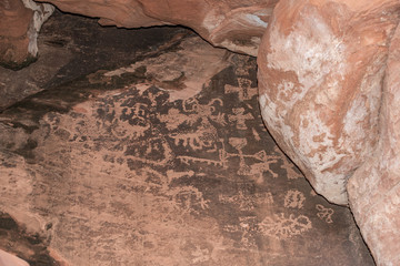 USA, Nevada, Clark County, Valley of Fire State Park - Mystical Bat Woman Petroglyph panel with cross intersections and other shapes
