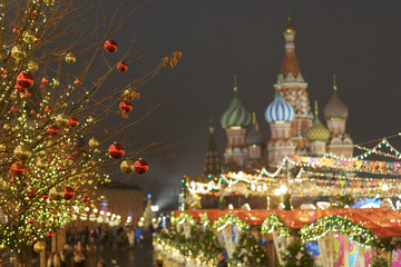 Bright illuminated Red Square, facade of the Saint Basil's Cathedral in Moscow. Lighting and decoration of the Red Square during winter night.