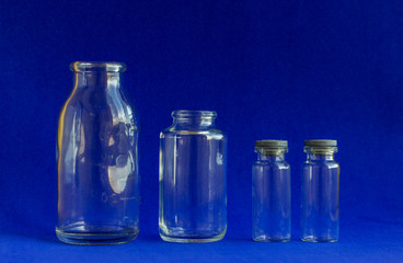 Glass bottles for medicines. .Container for liquid and dry medicines on a white background. Empty transparent jar for pills and vitamins.