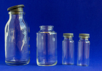 Glass bottles for medicines. .Container for liquid and dry medicines on a white background. Empty transparent jar for pills and vitamins.