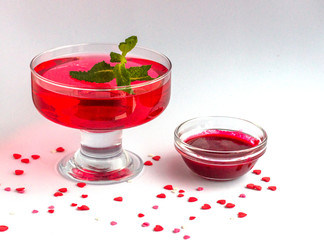Healthy dessert  frozen summer berries smoothie and jelly in glass cups on a white background.  Decorated with mint. Diet food and weight loss concept. ..