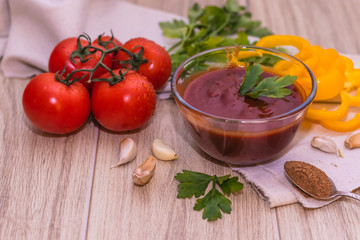 tomatoes paste with tomatoes on wooden tables
