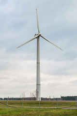 Renewable alternative clean wind energy produced by wind generators helps to preserve The earth's ecology. - 311619333