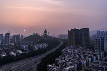 Fototapeta na wymiar the finale of golden hour landscape over residential buildings and a meteorological radar station in shenzhen china