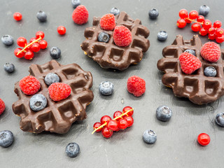 delicious waffles with forest berries breakfast concept