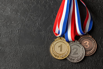 Gold, silver and bronze medal with ribbons. Award for first, second and third place in the...