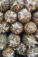 Big pineapple, close up. Exotic fruits at the grocery store. 