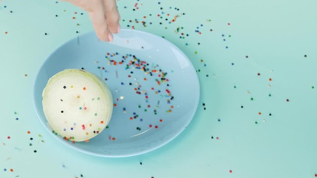  food design. half of the onion is sprinkled with confecti onery sugar sprinkles