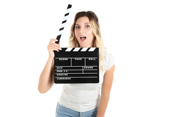 Young woman with blank clapper board on white background