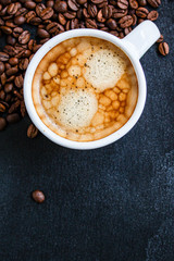 coffee in a white cup (freshly brewed aromatic hot drink, espresso or americano) menu concept. food background. top view. copy space
