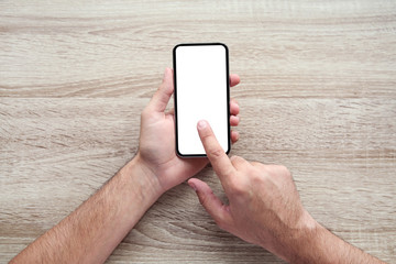 Man holding and using mobile phone