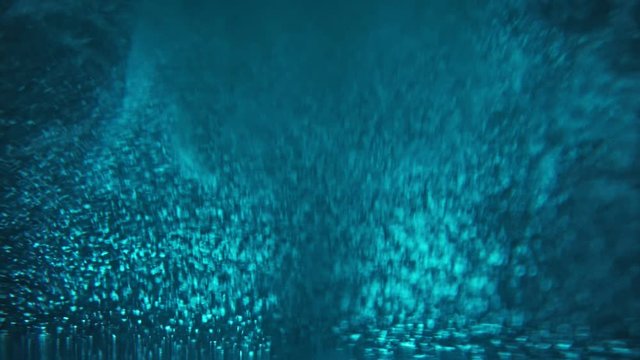 Paint fall into water which is twist. Spin acrylic ink drip into liquid. Visual effect bullet time, frozen moment, flow motion. Cloud fraction of color is spray drop. Slow motion cosmic video magic.